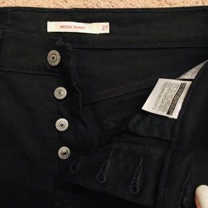 Levi Skinny Wedgie Fit Black raw hem button  fly